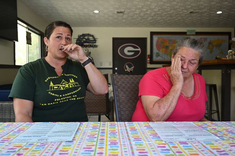 Sheila Carter (right) and her daughter Charlene Carter get emotional as they express concerns about new mining just outside the Okefenokee Swamp, which will take place near the Okefenokee Pastimes Cabins and Campground in Folkston, where they work. Staff photo by Hyosub Shin / Hyosub.Shin@ajc.com