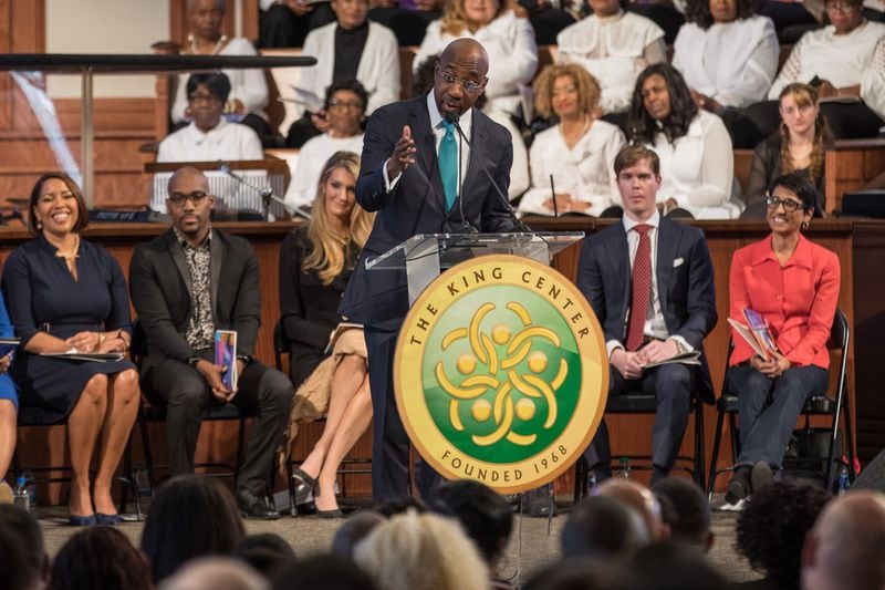 The Rev. Raphael G. Warnock speaks during the Martin Luther King Jr. annual commemorative service at Ebenezer Baptist Church in Atlanta on Monday, Jan. 20, 2020.  Behind him at left is U.S. Sen. Kelly Loeffler, whom Warnock would announce later in the month he would be challenging for her new seat. BRANDEN CAMP/SPECIAL