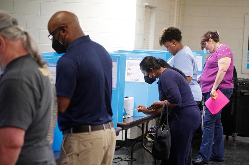 FILE - Voters cast their ballots in the Georgia primary on Tuesday May 24, 2022 at the Progressive Recreation Center in Garden City.