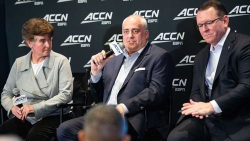 Wes Durham (right) joins ESPN senior coordinating producer Amy Rosenfeld (left) and “Packer and Durham” co-host Mark Packer (center) for a media event at the ACC basketball tournament Friday.