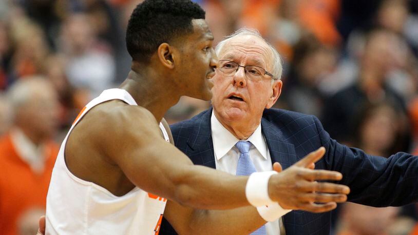 Syracuse head coach Jim Boeheim, right, talks with Syracuse Andrew White III, left, in the second half of an NCAA college basketball game against Georgia Tech in Syracuse, N.Y., Saturday, March 4, 2017. Syracuse won 90-61. (AP Photo/Nick Lisi)