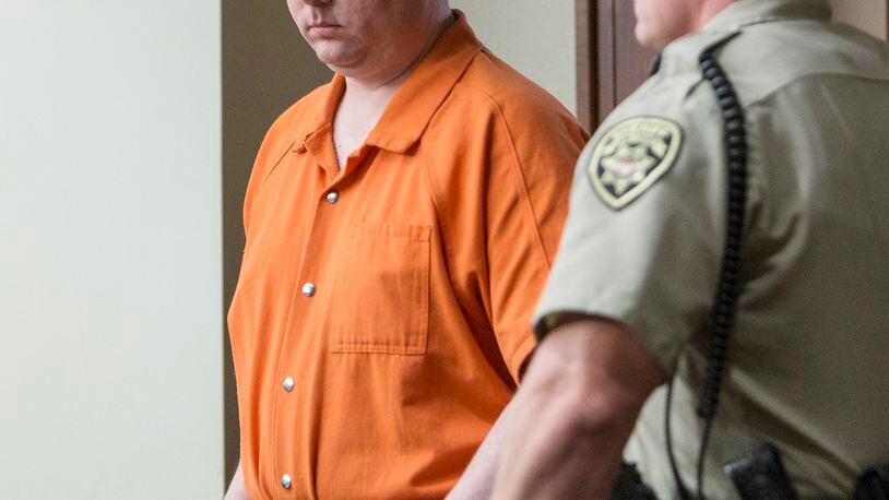 Justin Ross Harris enters the courtroom for a hearing Monday, Sept. 14, 2015, in Marietta, Ga. A judge on Monday refused to bar the news media from the courtroom during pretrial hearings for Harris, a Georgia man accused of killing his toddler son by leaving him in a vehicle on a hot day. (Kathryn Ingall/The Marietta Daily Journal via AP, Pool)