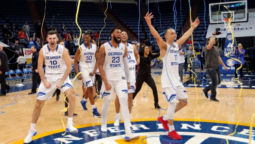 Georgia State celebrates their victory over Texas-Arlington in the Sun Belt Conference NCAA college basketball championship game in New Orleans, Sunday, March 11, 2018. Georgia State won 74-61. (AP Photo/Gerald Herbert)