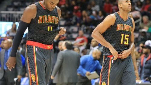 102715 ATLANTA: -- Hawks Paul Millsap (left) and Al Horford walk off the court falling 106-94 to the Pistons in their first regular season basketball game "home opener" on Tuesday, Oct. 27, 2015, in Atlanta. Curtis Compton / ccompton@ajc.com