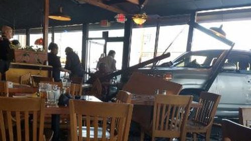 Malone's Steak and Seafood will be closed for repairs after a man crashed through the window and injured three people in the dining room Wednesday. (Credit: Channel 2 Action News)