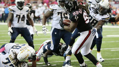 October 23, 2016 Atlanta: Falcons defensive end Adrian Clayborn recovers a fumble by Chargers quarterback Philip Rivers on a sack by Vic Beasley Jr. and returns it for a touchdown for a 27-10 lead during the second quarter in an NFL football game on Sunday, Oct. 23, 2016, in Atlanta. Curtis Compton /ccompton@ajc.com