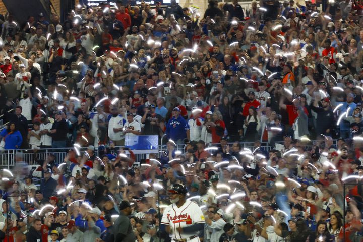 Fans wave lights during the seventh inning of NLDS Game 2 in Atlanta on Monday, Oct. 9, 2023.   (Miguel Martinez / Miguel.Martinezjimenez@ajc.com)