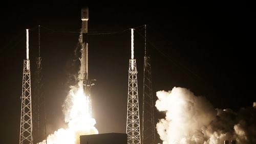 A SpaceX Falcon 9 rocket lifts off with Israel's Lunar Lander and an Indonesian communications satellite at space launch complex 40, Thursday, Feb. 21, 2019, in Cape Canaveral, Fla. An Israeli spacecraft blasted off to the moon in an attempt to make the country's first lunar landing, following a launch Thursday night by SpaceX. (AP Photo/Terry Renna)