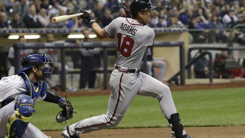 Lane Adams, pictured getting a hit in his early season stint with the Braves, was called up again Wednesday when he played in Triple-A and major league games in the same day. (AP file photo)