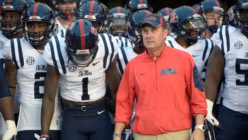 FILE - In this Oct. 3, 2015, file photo, Mississippi coach Hugh Freeze waits to take the field before the team's NCAA college football game against Florida in Gainesville, Fla. Freeze has resigned after five seasons, bringing a stunning end to a once-promising tenure. The school confirmed Freeze's resignation in a release Thursday night. Assistant Matt Luke has been named the interim coach. (AP Photo/Phelan M. Ebenhack, File)