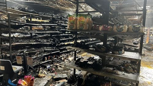 A massive fire in the retail area of the Peachtree City Walmart Supercenter scorched large sections of the store and caused a partial roof collapse overnight Aug. 24.