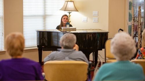 Kate Lauterbach sings and interacts with residents at Sanford Estates in Roswell. The 17-year-old Marist student has a passion for singing and is channeling it into a day-brightener for seniors. PHIL SKINNER FOR THE ATLANTA JOURNAL-CONSTITUTION.