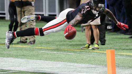 Falcons wide receiver Julio Jones soars into the endzone to score his second touchdown on the day during the second quarter against the Buccaneers in a NFL football game last November in Atlanta. (Curtis Compton/ccompton@ajc.com).
