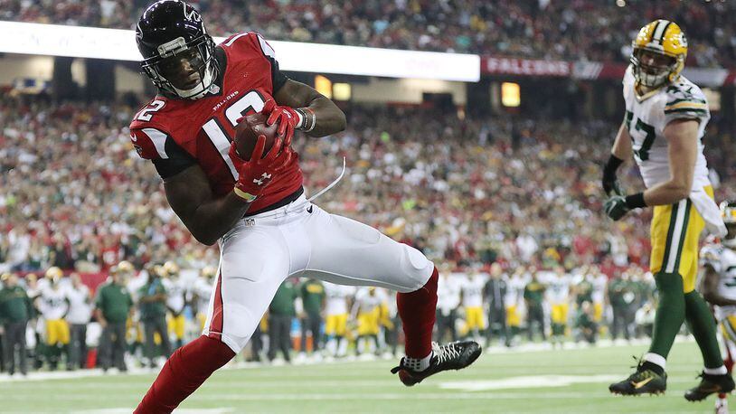 Falcons wide receiver Mohamed Sanu catches the game-winning touchdown pass from Matt Ryan past Packers defender Jake Ryan for a 33-32 victory Sunday, Oct. 30, 2016, at the Georgia Dome in Atlanta.