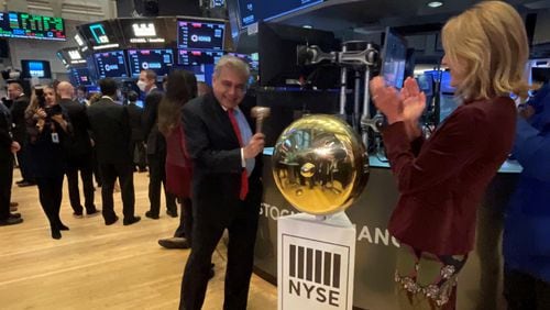 Alpharetta-based tech company KORE Global Holdings became a publicly traded company Friday, with its shares trading on the New York Stock Exchange. Company chief executive officer Romil Bahl rang the trading floor bell. Photo courtesy of KORE.