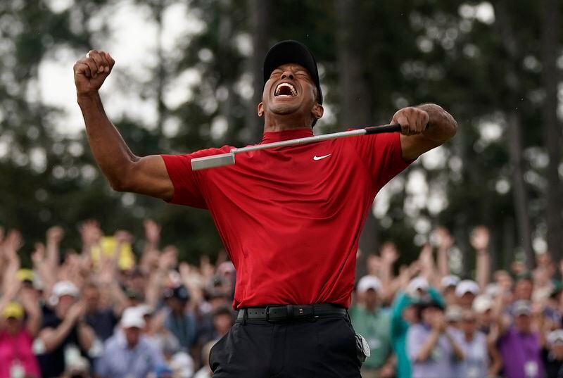 FILE - Tiger Woods reacts as he wins the Masters golf tournament Sunday, April 14, 2019, in Augusta, Ga. Woods won his 15th major at the Masters five years ago.(AP Photo/David J. Phillip, File)
