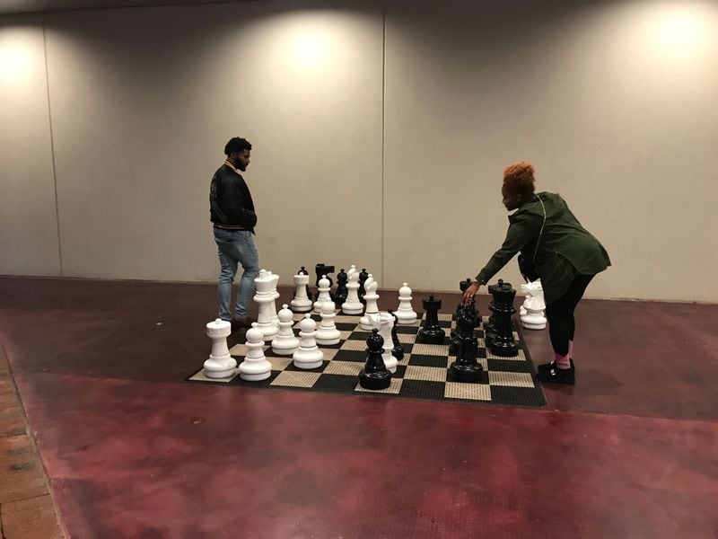 Auddia Granberry and LeAnthony Freeman play chess at Atlantic Station instead of watching the Super Bowl on Sunday, Feb. 3, 2019.