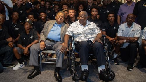 Andrew Young (left) and Hank Aaron pose for photos with the participants at the end of the Hank Aaron Invitational at SunTrust Park in Atlanta Aug. 2, 2019.  STEVE SCHAEFER / SPECIAL TO THE AJC