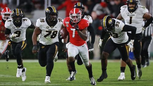 Georgia tailback D’Andre Swift makes a long gain for a first down against Missouri during the third quarter in an NCAA college football game on Nov. 9, 2019, in Athens. CURTIS COMPTON / CCOMPTON@AJC.COM