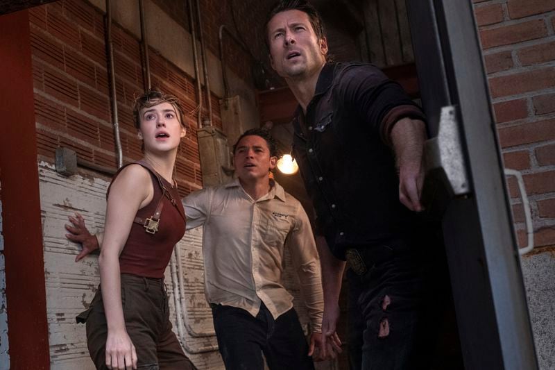 This image released by Universal Pictures shows Daisy Edgar-Jones, from left, Anthony Ramos and Glen Powell in a scene from "Twisters." (Melinda Sue Gordon/Universal Pictures via AP)