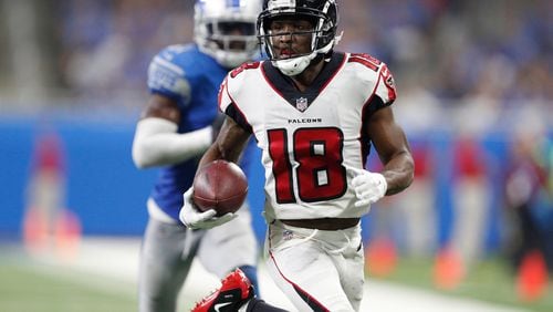 Atlanta Falcons wide receiver Taylor Gabriel (18) runs after a catch for a touchdown during the fourth quarter against the Detroit Lions at Ford Field.