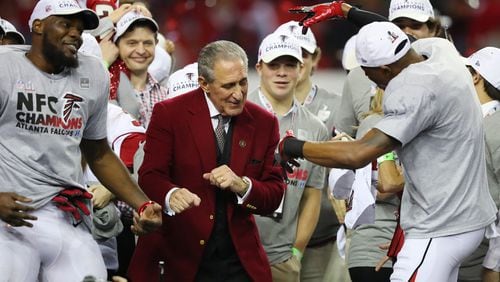 Falcons owner Arthur Blank dances on stage with his players after beating the Packers 44-21 in the NFL football NFC Championship game on Sunday, Jan. 22, 2017, in Atlanta. Curtis Compton, ccompton@ajc.com