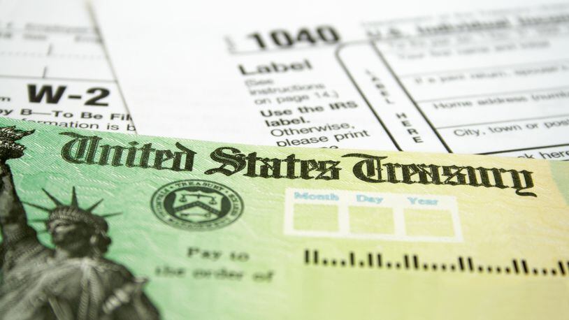 Tax Refund Check with W-2 and 1040 U.S. Individual Income Tax Return Forms (Getty Images/TNS)