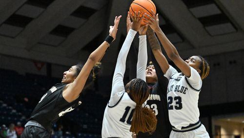 Brookwood's Diana Collins (left), Norcross' Kayla Lindsey (10) Brookwood's Jade Weathersby (23) and Norcross' Jania Akins (rihgt) fight for a rebound during 2023 GHSA Basketball Class 7A Girl’s State Championship game at the Macon Centreplex, Saturday, March 11, 2023, in Macon, GA. (Hyosub Shin / Hyosub.Shin@ajc.com)