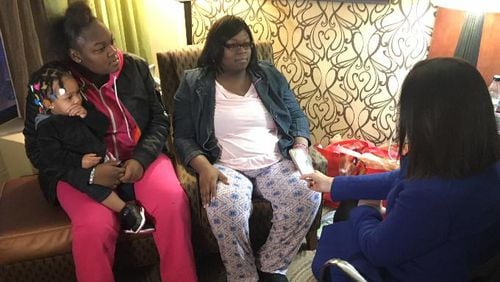 De'Errica Hines, her mother and the little sister she rescued talk about what the teenager did to rescue the young one and two cousins from a fire in the apartment complex where they lived. (Michael Burianek/Staff)