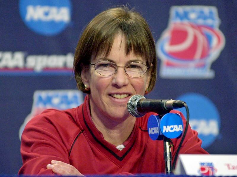 FILE - Stanford head coach Tara VanDerveer smiles during a news conference in Stanford, Calif., Sunday, March 23, 2003. VanDerveer, the winningest basketball coach in NCAA history, announced her retirement Tuesday night, April 9, 2024, after 38 seasons leading the Stanford women’s team and 45 years overall. (AP Photo/Paul Sakuma, File)