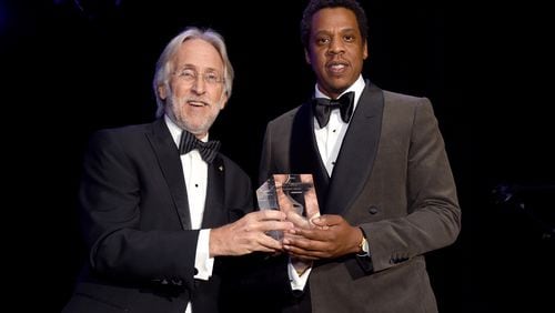 Recording Academy President/CEO Neil Portnow presents Jay-Z with Grammy Salute to Industry Icons Award at the Clive Davis and Recording Academy Pre-GRAMMY Gala on Jan. 27, 2018 in New York City. (Photo by Michael Kovac/Getty Images for NARAS)