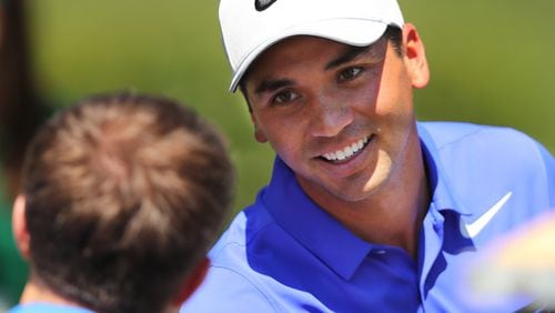Jason Day chats with a patron after his practice round for the Masters at Augusta National Golf Club on Tuesday. (Curtis Compton/ccompton@ajc.com)