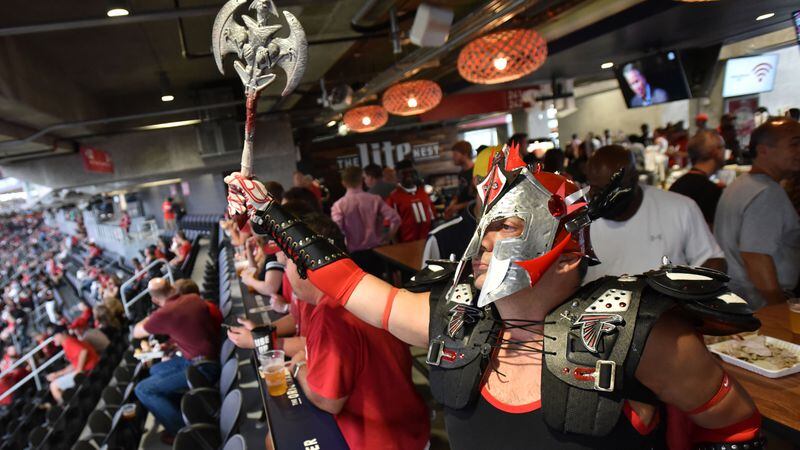 August 26, 2017 Atlanta - Joey Bellows, of Peachtree City, shows his supports with his costume before an exhibition game against the Arizona Cardinals at new Mercedes-Benz Stadium on Saturday, August 26, 2017. HYOSUB SHIN / HSHIN@AJC.COM