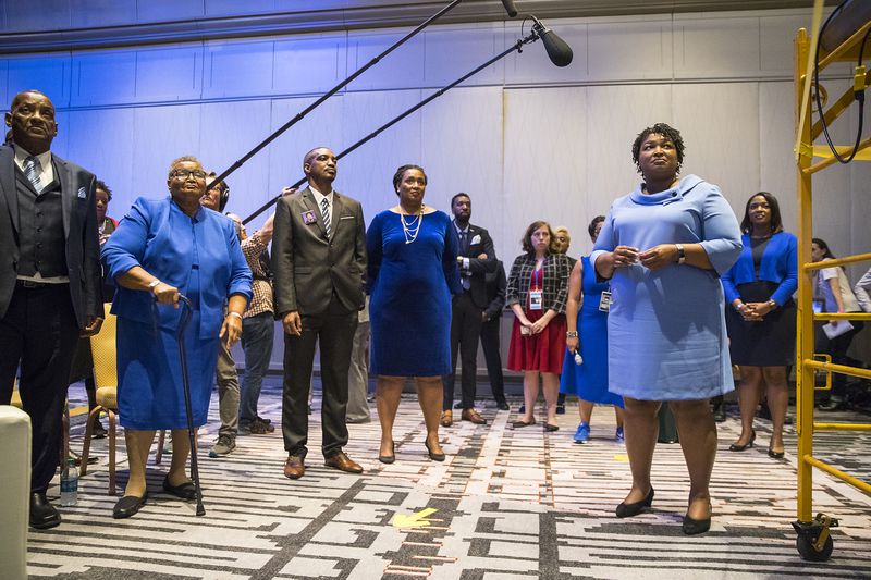11/07/2018 -- Atlanta, Georgia -- Georgia gubernatorial candidate Stacey Abrams (right) waits backstage with her family and friends before speaking to a crowd of supporters during her election night watch party at the Hyatt Regency in Atlanta, Wednesday, November 7, 2018. Georgia's gubernatorial race was too close to call, possibly signaling a run-off election. (ALYSSA POINTER/ALYSSA.POINTER@AJC.COM)