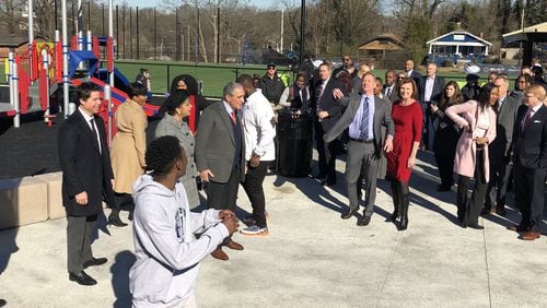 NFL Commissioner Roger Goodell tosses a football to a Tyriq Dabney, a student at Hollis Innovation Academy in the Vine City neighborhood near Mercedes-Benz Stadium on Thursday, Jan. 31, 2019. Goodell, Atlanta Falcons owner Arthur Blank and Mayor Keisha Lance Bottoms helped commemorate the re-opening of John F. Kennedy Park, which underwent a five-month renovation as part of a gift from the NFL Foundation and the Atlanta Super Bowl Host Committee. J. SCOTT TRUBEY/STRUBEY@AJC.com