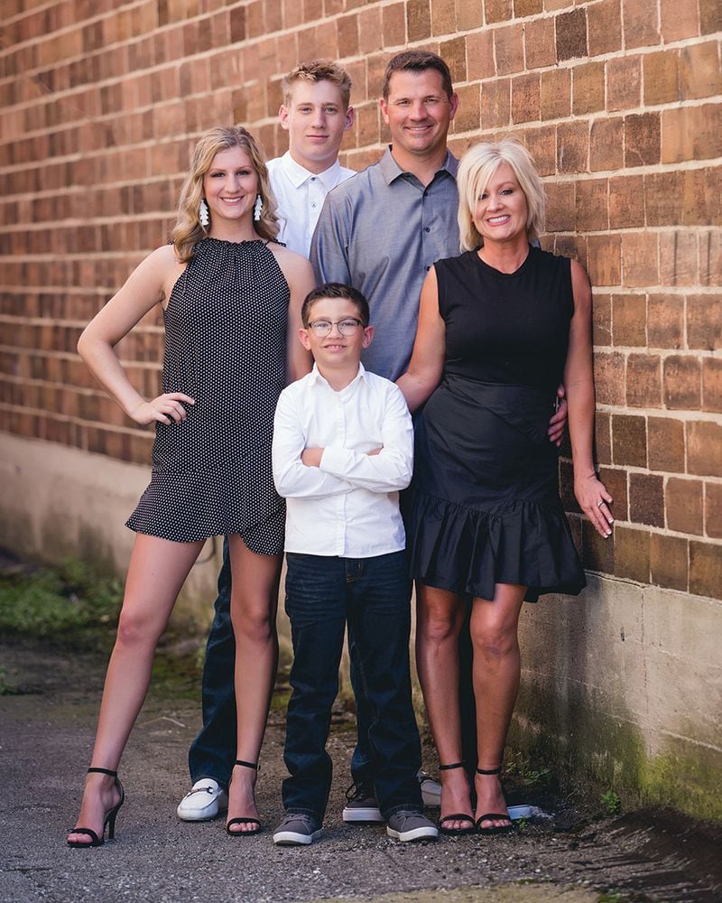 Ball State football coach Mike Neu (right center) with his family in 2019. From left, his daughter, Graycen; his oldest son, Carson; his youngest son, Chase; his wife, Charmin. (Photo courtesy of Ball State Athletics)