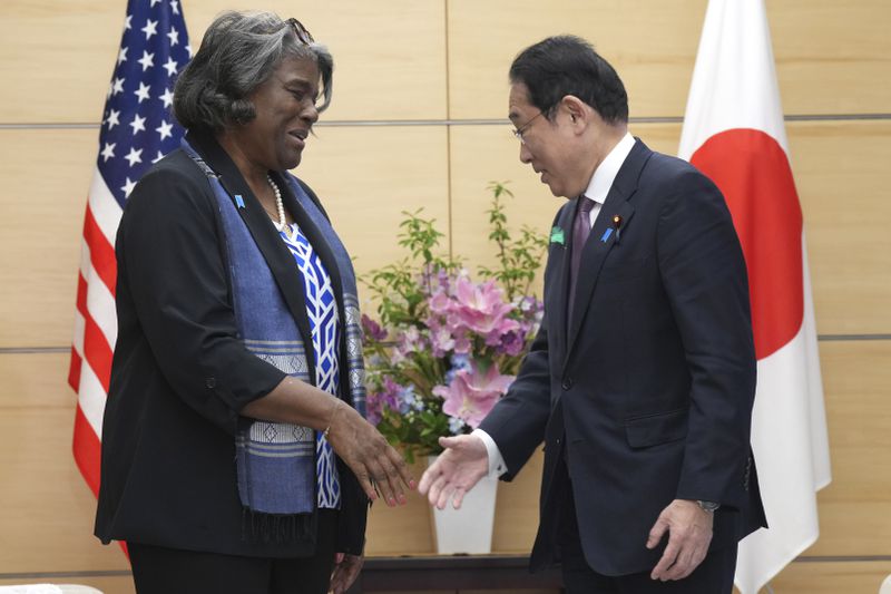 U.S. Ambassador to United Nations Linda Thomas-Greenfield, left, and Japan's Prime Minister Fumio Kishida, right, talk prior to a meeting Friday, April 19, 2024, at prime minister's office in Tokyo. (AP Photo/Eugene Hoshiko, Pool)