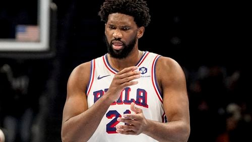 Philadelphia 76ers center Joel Embiid (21) reacts to a team foul against the Atlanta Hawks during the first half of an In-Season Tournament NBA basketball game, Friday, Nov. 17, 2023, in Atlanta. (AP Photo/Mike Stewart)