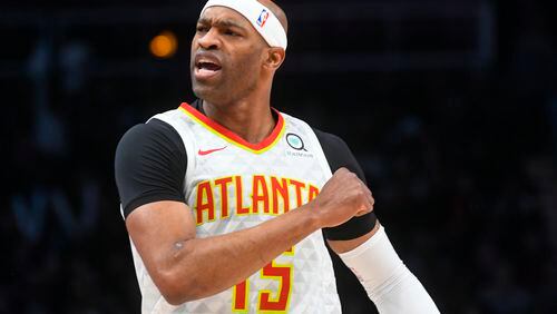 Hawks forward Vince Carter reacts after making a three-point basket. (AP Photo/John Amis)