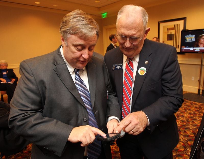 In this AJC file photo from November 2010, Ralph Hudgens, right, Republican candidate for commissioner of insurance, watches returns coming in with supporter Jim Beck, left, at the Georgia Republican party's election night event.  Curtis Compton, ccompton@ajc.com