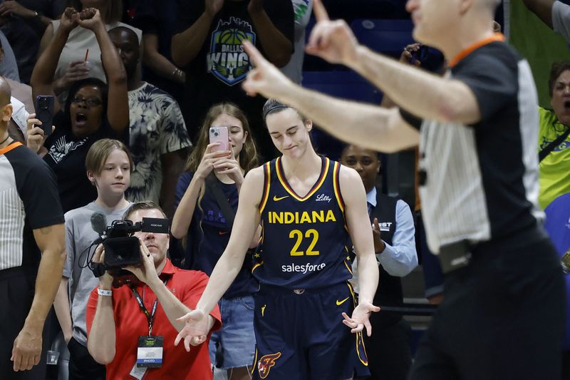 Indiana Fever guard Caitlyn Clark (22) reacts after missing a three-point shot as they lost to the Dallas Wings during an WNBA basketball game in Arlington, Texas, Friday, May 3, 2024. (AP Photo/Michael Ainsworth)