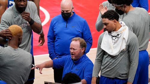 Milwaukee Bucks coach Mike Budenholzer talks to his team during a timeout in the second half of Game 3 of the NBA Eastern Conference basketball finals against the Atlanta Hawks, Sunday, June 27, 2021, in Atlanta. (AP Photo/Brynn Anderson)