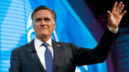 In this Jan. 19, 2018,, file photo, former Republican presidential candidate Mitt Romney waves after speaking about the tech sector during an industry conference, in Salt Lake City. (AP Photo/Rick Bowmer, File)