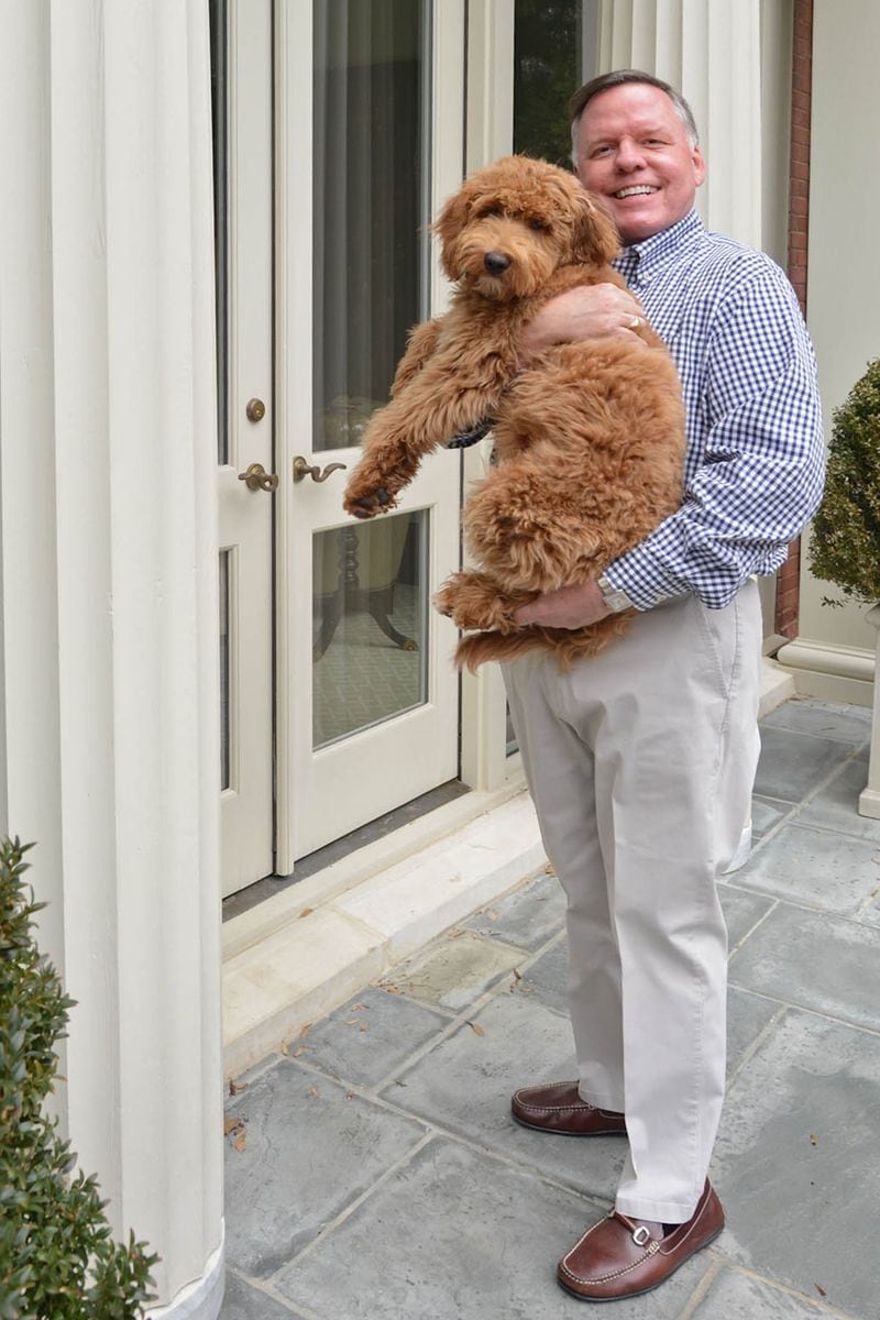 John Banks, owner of John S. Banks Interiors, purchased the Buckhead home in 2013, attracted by its outdoor space for entertaining and his goldendoodle, Rudy, and its architectural style. "I loved the neoclassical style all throughout," he said.