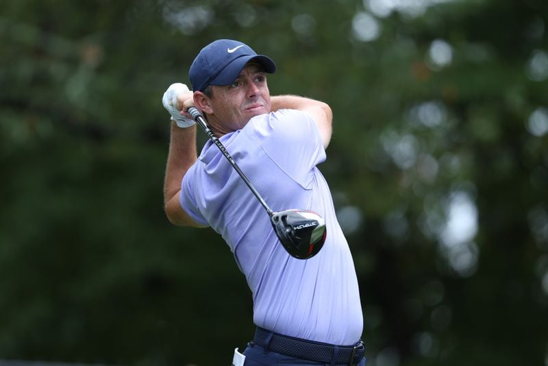 Rory McIlroy tees off on the fifth hole during the first round of the Tour Championship at East Lake Golf Club, Thursday, August 25, 2022, in Atlanta. (Jason Getz / Jason.Getz@ajc.com)