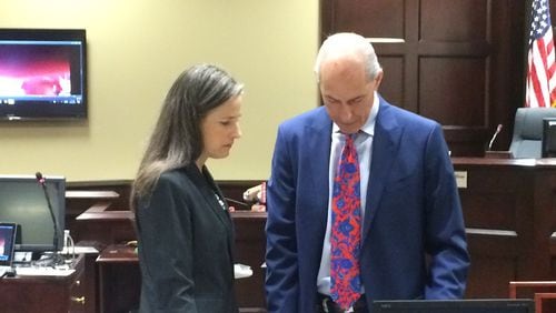Nydia Tisdale, left, consults with one of her attorneys, Bruce Harvey, at a hearing in Dawsonville in October 2016. Jury selection began Monday in her trial involving her arrest at a Republican Party function she tried to videotape.