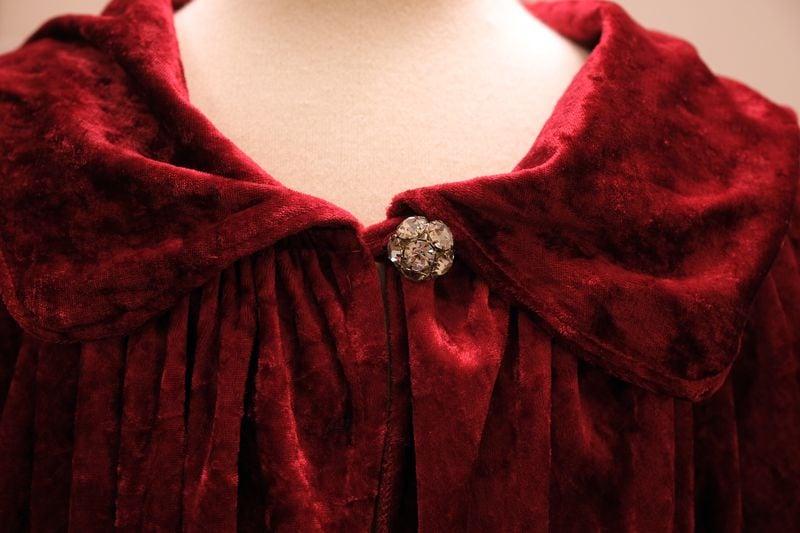 A detail on a red velvet James Brown cape that is part of the Georgia Music collection housed on campus at the Special Collections Library in Athens, GA, Thursday, Feb. 1, 2024.  (Nell Carroll for The Atlanta Journal-Constitution)