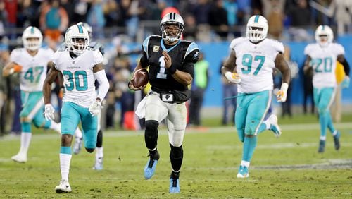 CHARLOTTE, NC - NOVEMBER 13:  Cam Newton #1 of the Carolina Panthers runs with the ball against the Miami Dolphins during their game at Bank of America Stadium on November 13, 2017 in Charlotte, North Carolina.  (Photo by Streeter Lecka/Getty Images)