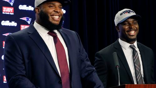 New England Patriots first-round NFL draft picks, offensive lineman Isaiah Wynn, left, and running back Sony Michel, both out of the University of Georgia, laugh during a media availability, Friday, April 27, 2018, in Foxborough, Mass. (AP Photo/Bill Sikes)