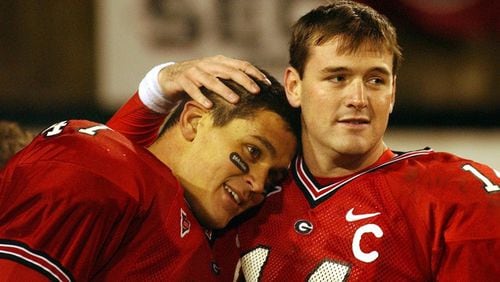 Georgia quarterback David Greene (right) gives David Pollack, longtime friends before arriving together at UGA, a hug after they played their last home at Sanford Stadium on Saturday, November 27, 2004. (JOHNNY CRAWFORD/AJC staff)